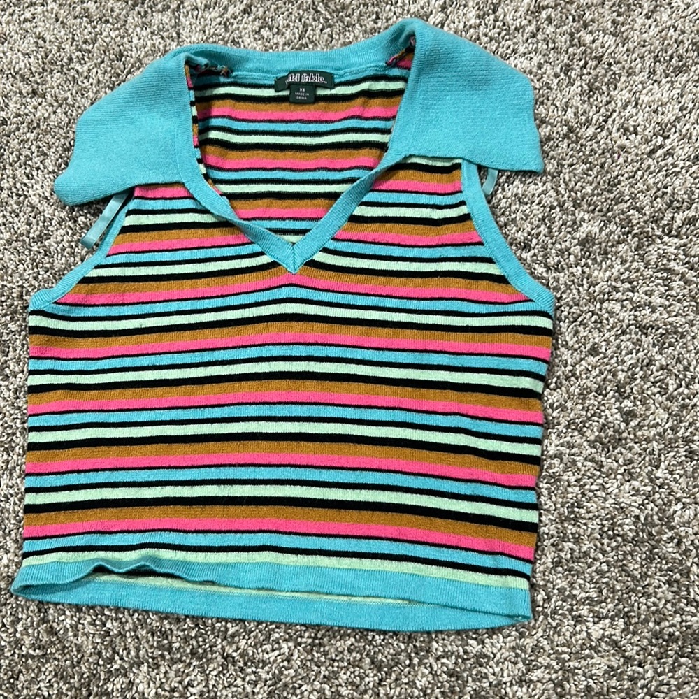V-neck knitted crop top, striped with blue, black, teal, orange, and pink.